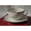 white porcelain cup & saucer with golden rim